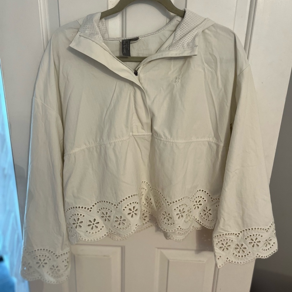 Sweaty Betty cream half zip athleisure jacket with eyelet trim and underarm vent